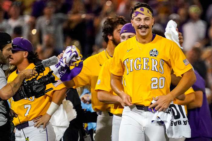 Jun 26, 2023; Omaha, NE, USA; LSU Tigers pitcher Paul Skenes (20) smiles after winning the College World Series over the Florida Gators at Charles Schwab Field Omaha. Mandatory Credit: Dylan Widger-USA TODAY Sports